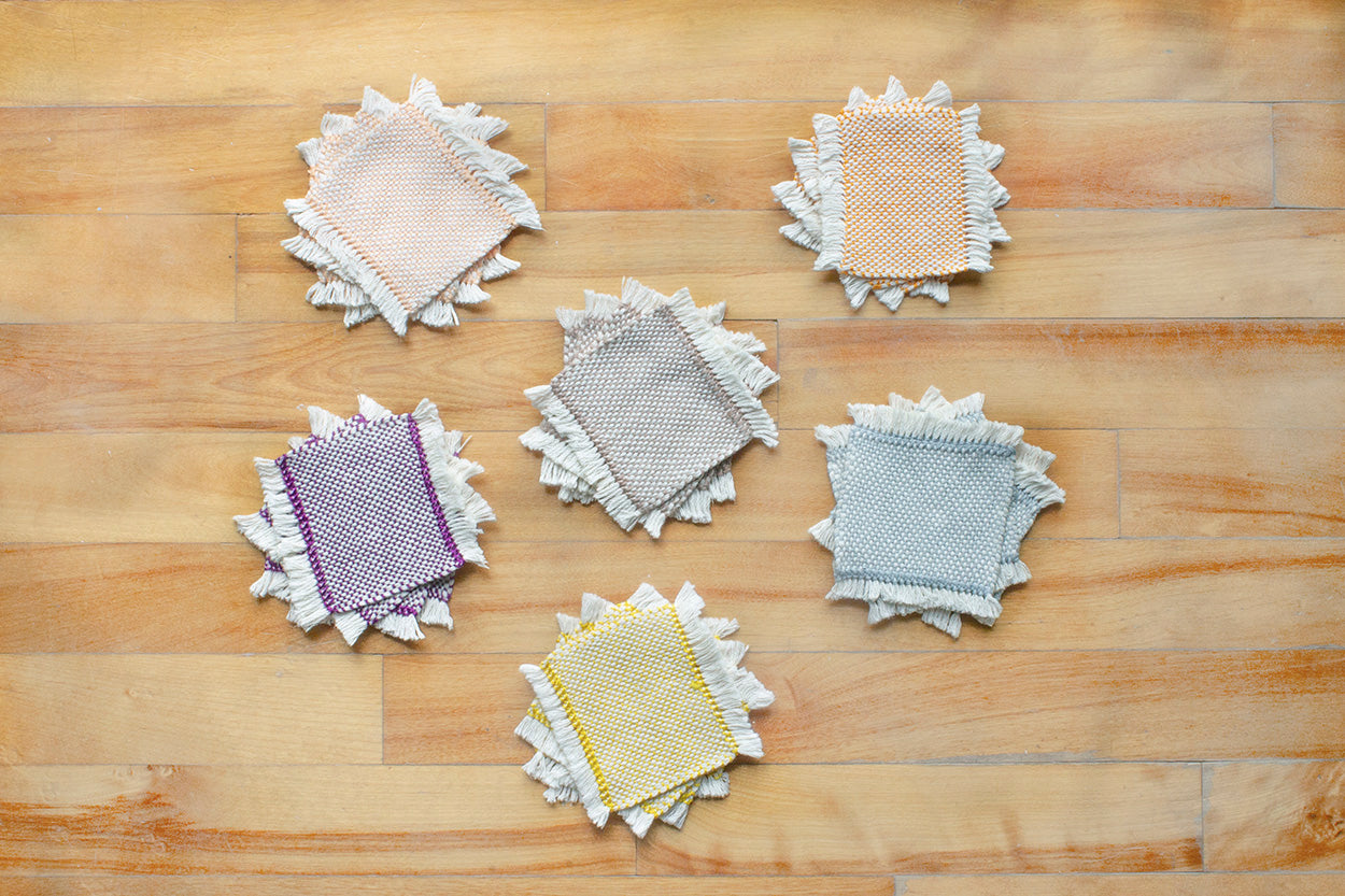 Cotton coasters, set of four, Pale Orange, Blue-grey, Brown, Bright Yellow, Bright Orange, Purple, handmade, natural fibres, hemstitched, made in Canada