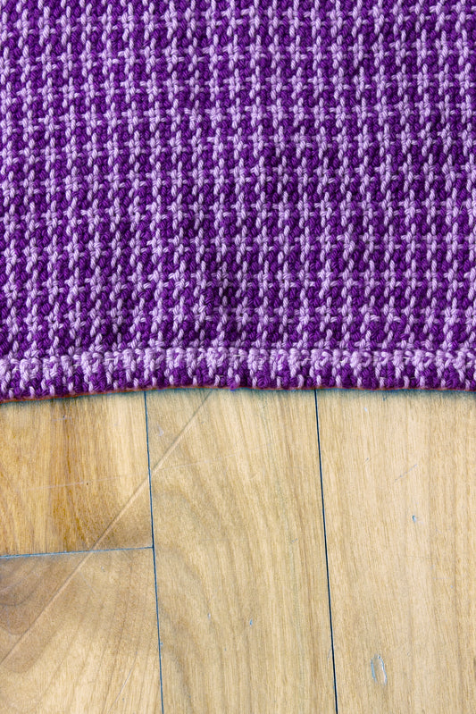 Cotton dish towel, purple houndstooth pattern, light purple, dark purple, handmade, natural fibres, locally sourced yarn, hemstitched, hemmed, hand sewn hem, washer and dryer safe, woven in Canada