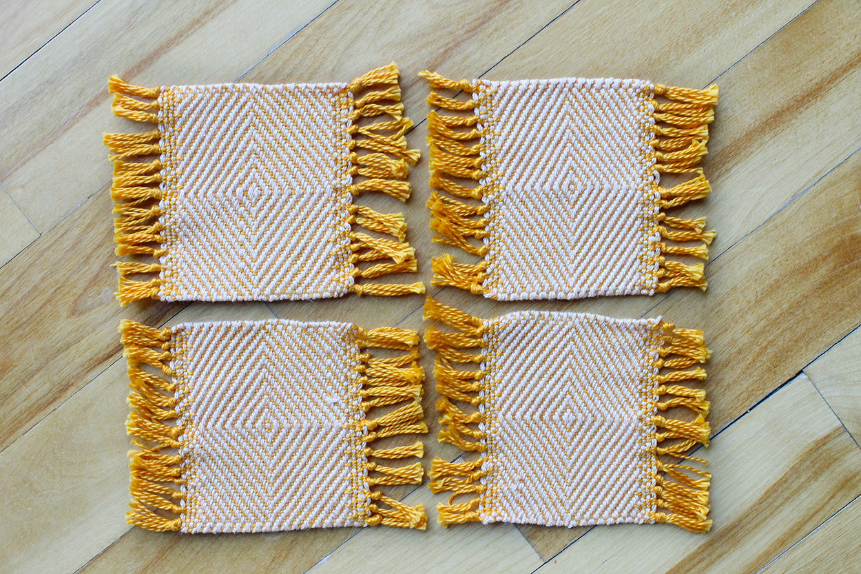 Cotton coasters, set of four, diamond pattern, pale orange, bright orange, handmade, natural fibres, washer safe, made in Canada
