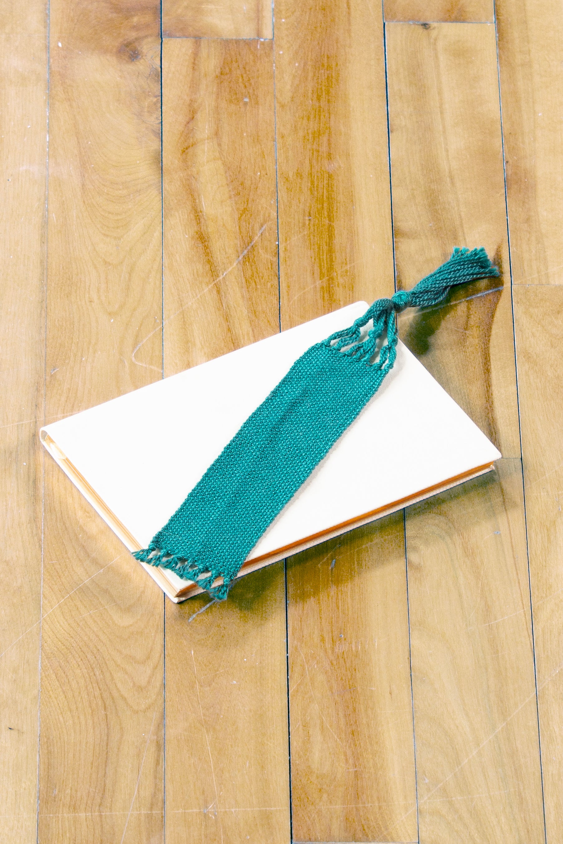 Cotton bookmark, Green medium, handmade, natural fibres, decorative fringe, woven in Canada
